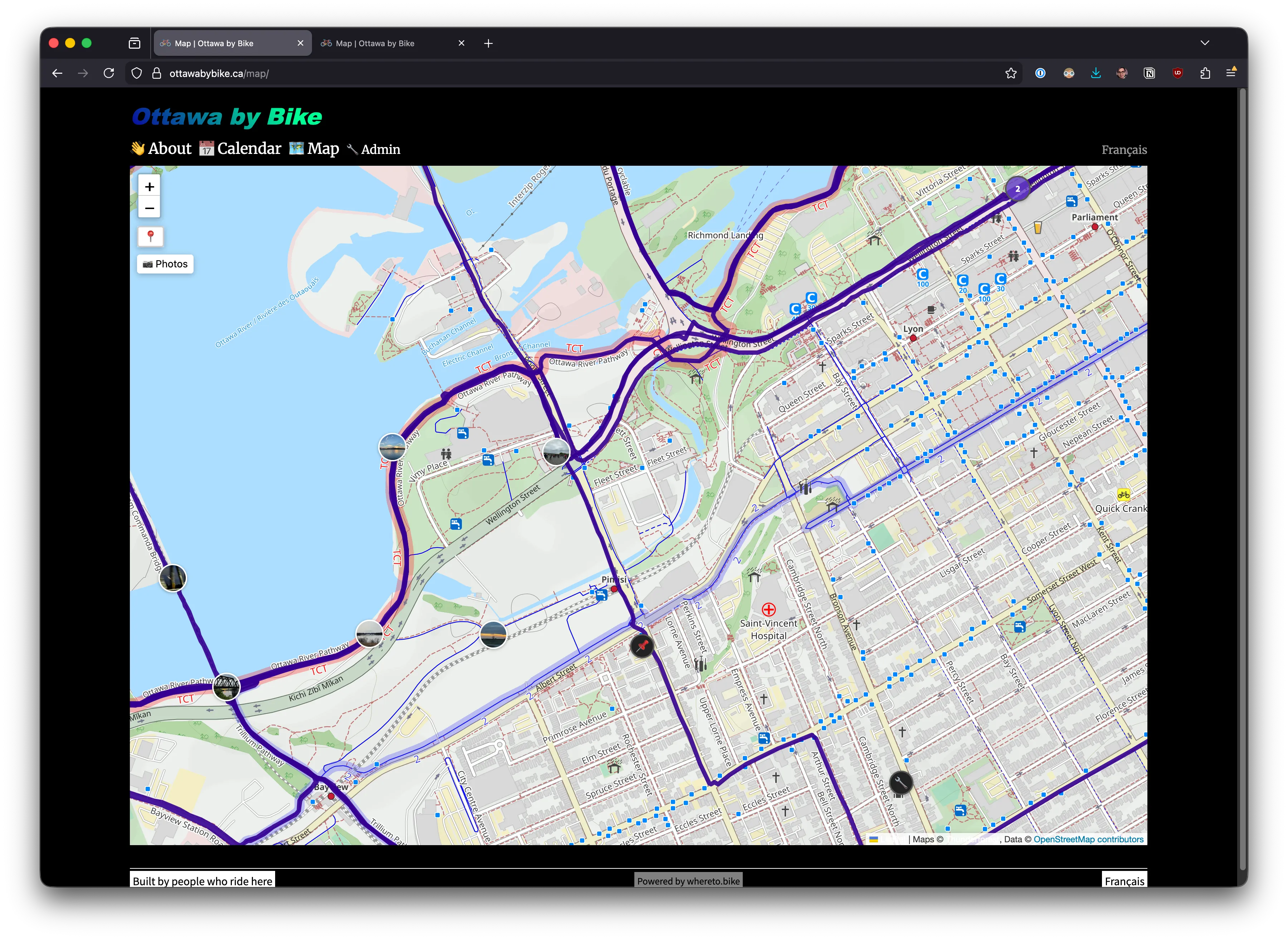 Downtown Ottawa on standard map tiles — dense labels, blue bike lane markers, road hierarchy all at similar visual weight